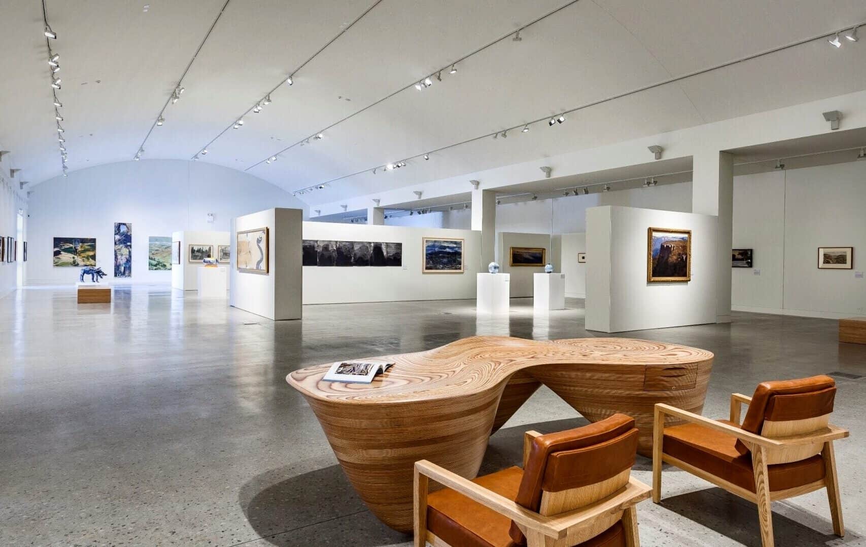 Modern art gallery with white walls, paintings, and sculptures on display, evoking the refined atmosphere of the Blue Mountains Cultural Centre in Katoomba. | Werriberri