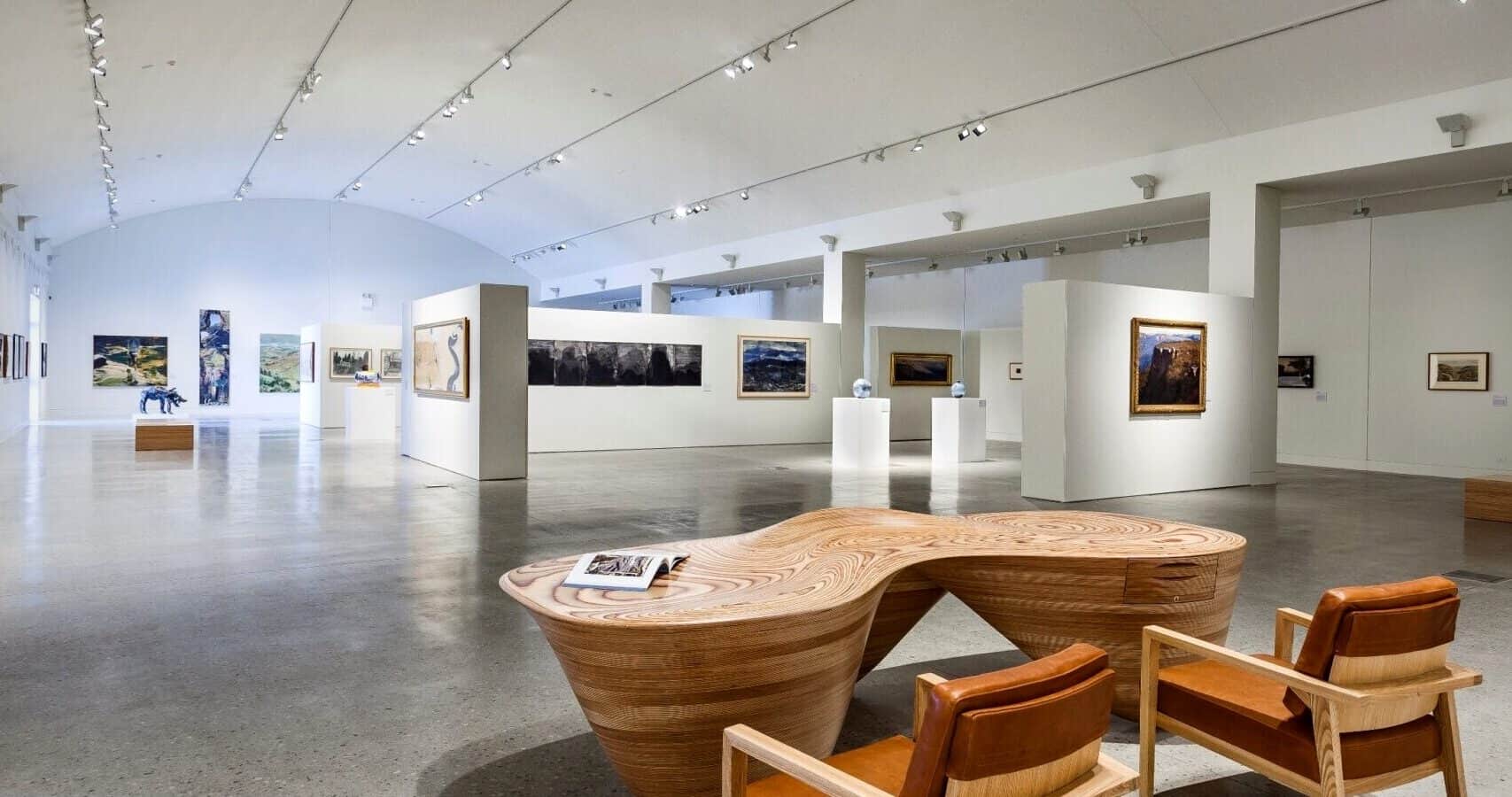 Modern art gallery with white walls, paintings, and sculptures on display, evoking the refined atmosphere of the Blue Mountains Cultural Centre in Katoomba. | Werriberri