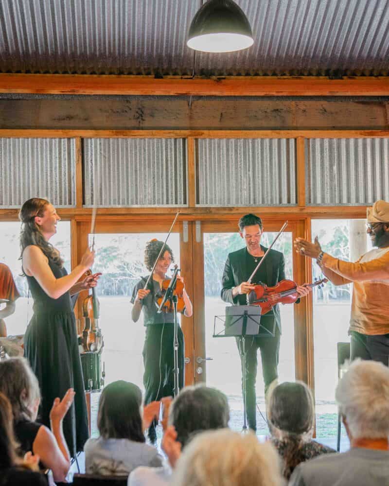 Live band performing at Megalong Valley Music Festival 2027 in a rustic venue.