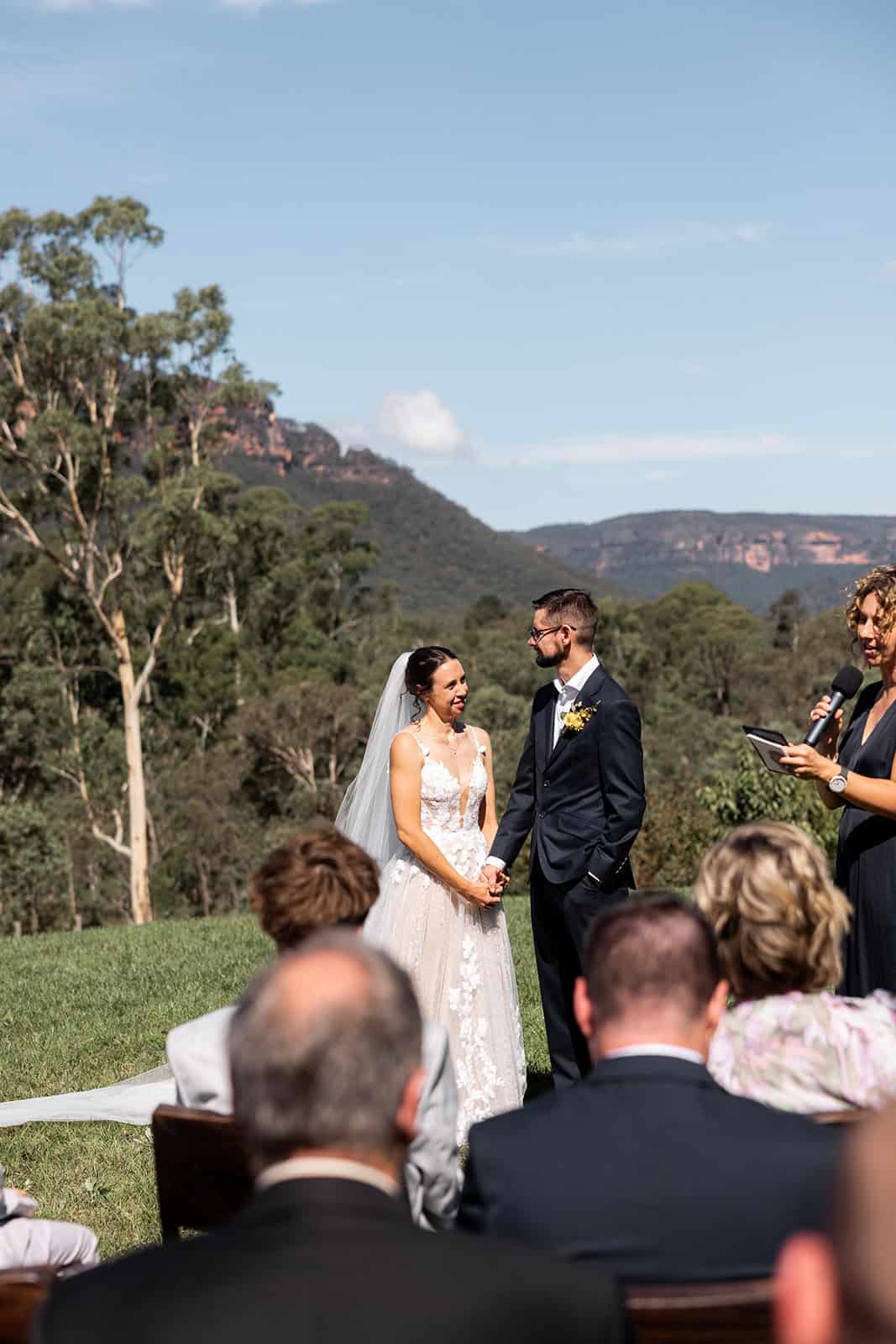Beautiful outdoor wedding ceremony at Megalong Valley with scenic mountain views.