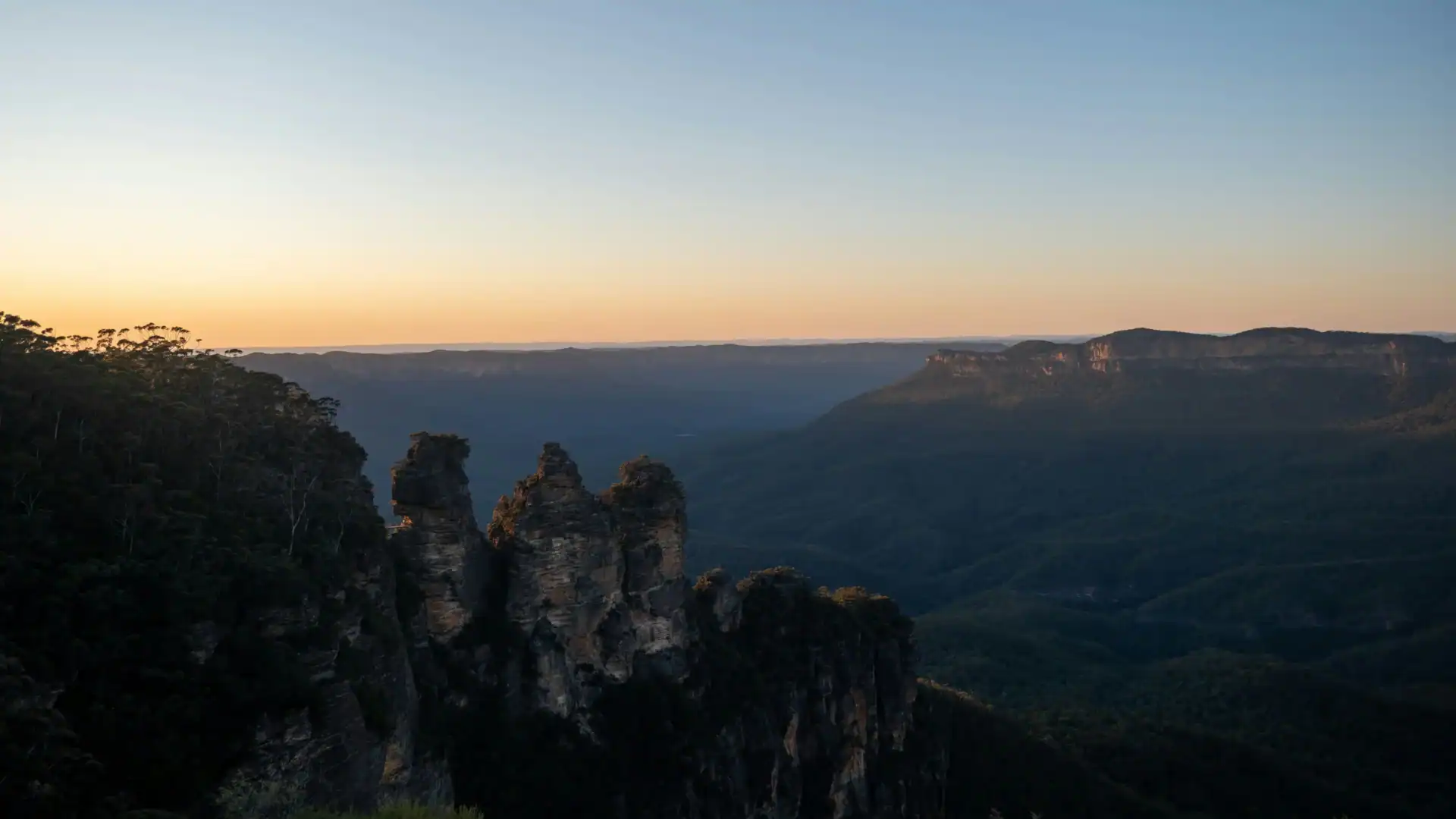 Beautiful landscape of cliffs and valley at sunset with clear sky.