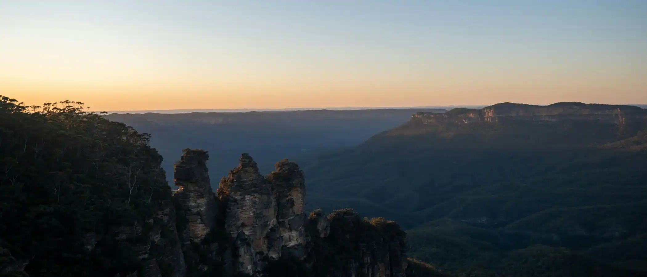 Beautiful landscape of cliffs and valley at sunset with clear sky.