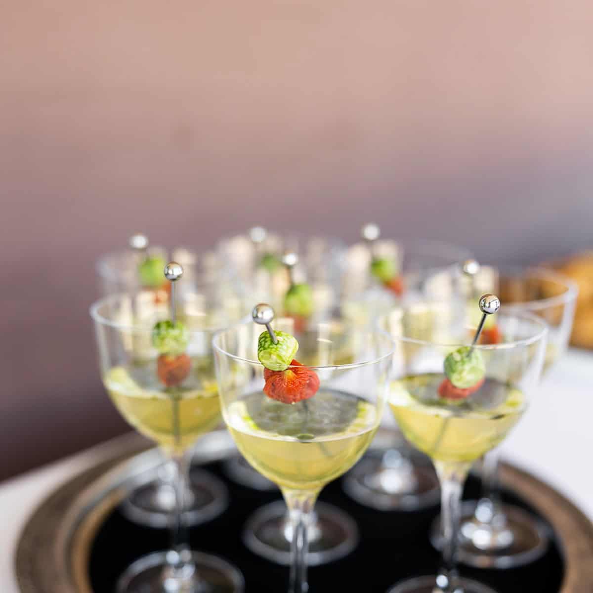 Assorted cocktails with garnishes on a tray at LOT 101.